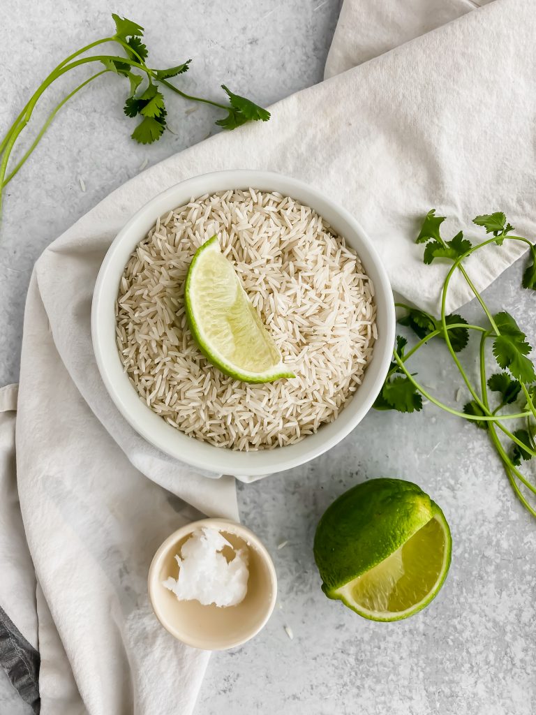 dry rice in a bowl with a lime wedge on top
