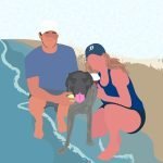 Couple on the beach holding their dog and drinks
