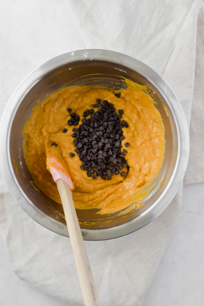 pumpkin banana bread batter completely mixed together with chocolate chips