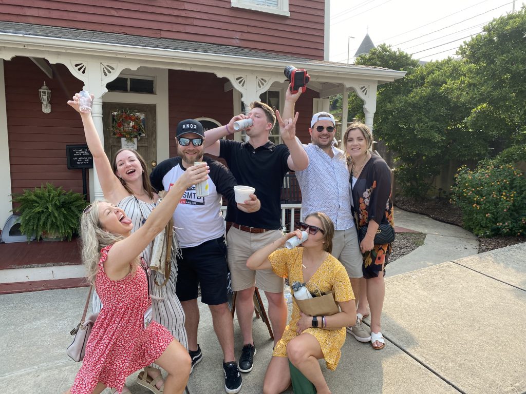group of guys and girls being silly and drinking