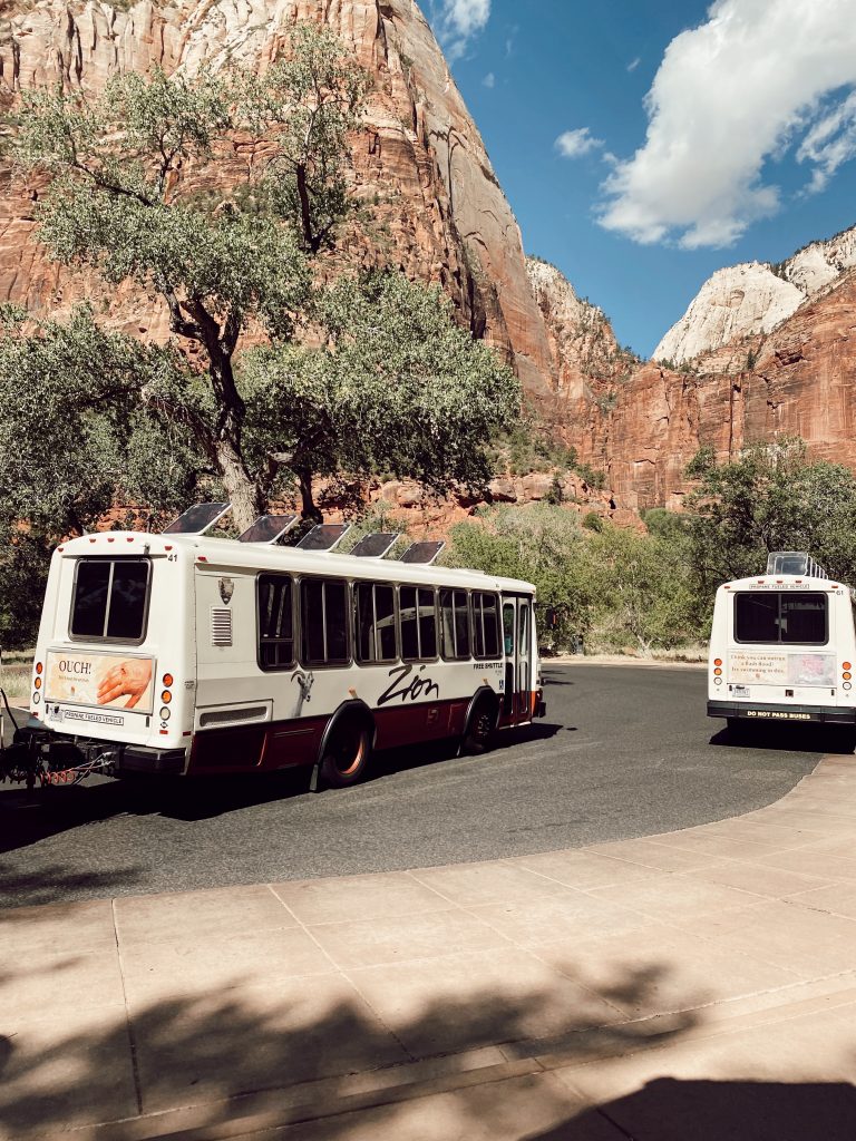two national park buses in Zion National Park