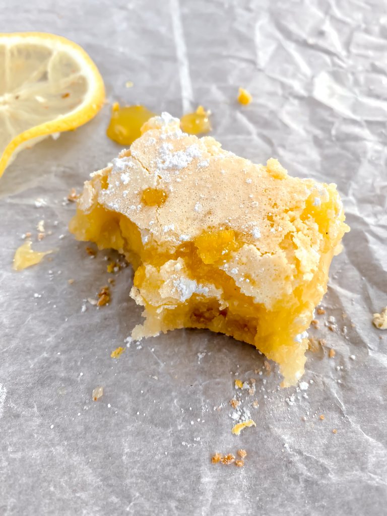 a lemon bar with several bites taken out of it