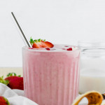 Strawberry Banana Protein Smoothie in ribbed glass with a metal straw