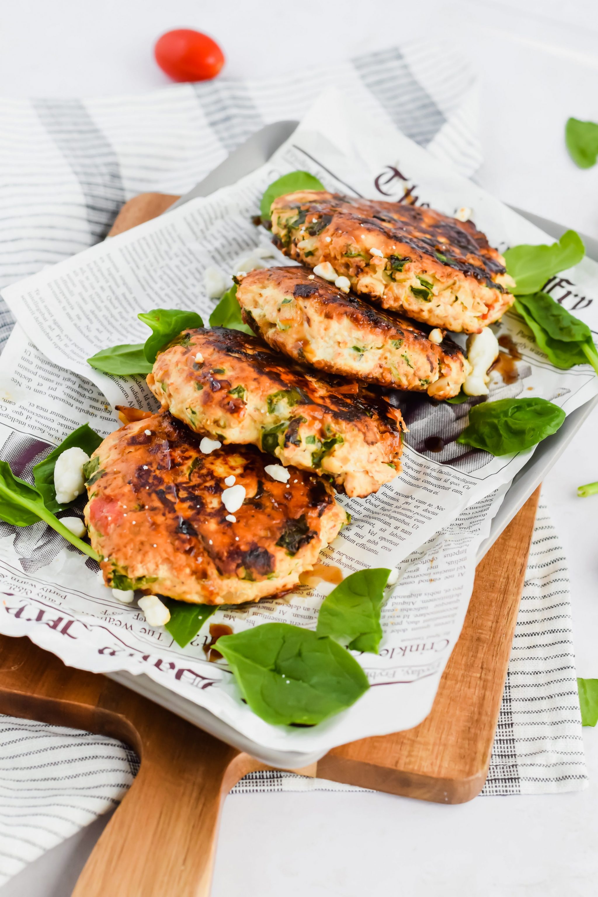 4 Roasted Garlic and Basil Chicken Burgers layered on top of each other