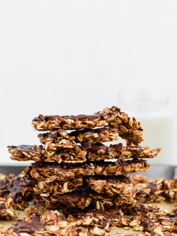 peanut butter chocolate granola clusters stacked on top of each other