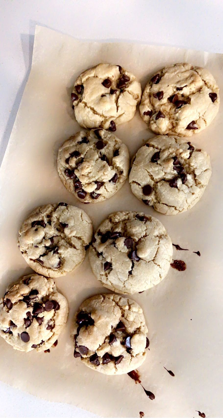 eight cookies baked on parchment paper