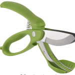 green scissors for salad on white background