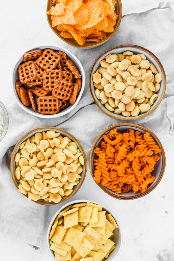 ingredients of ranch snack mix organized in small bowls