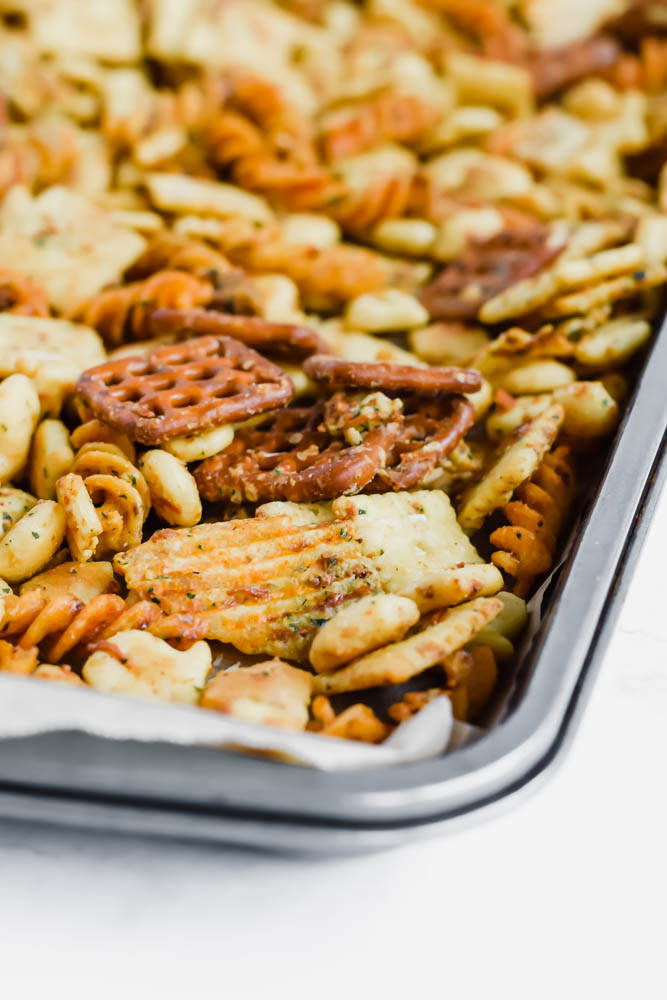 close up of sheet pan of baked ranch snack mix
