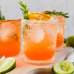 garnished Italian Margaritas with fresh rosemary and dried oranges