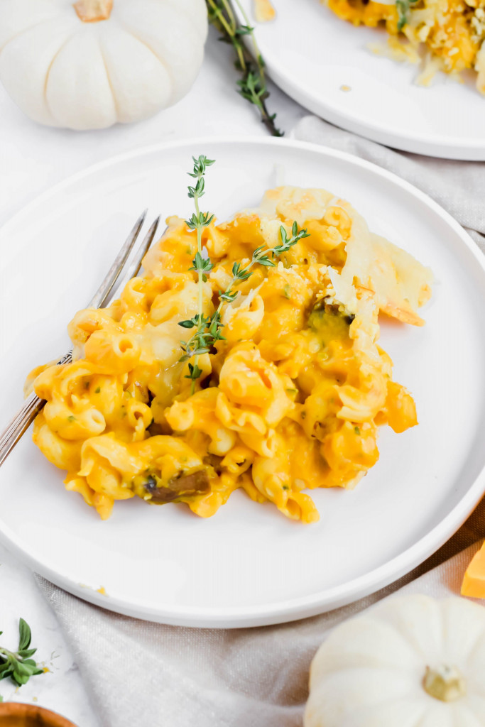 single serving of Trader Joe's Butternut Squash Mac and Cheese garnished with fresh thyme on top.