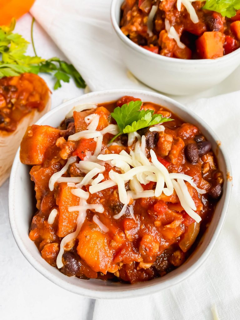 sweet potato turkey chili topped with cheese and seasoning