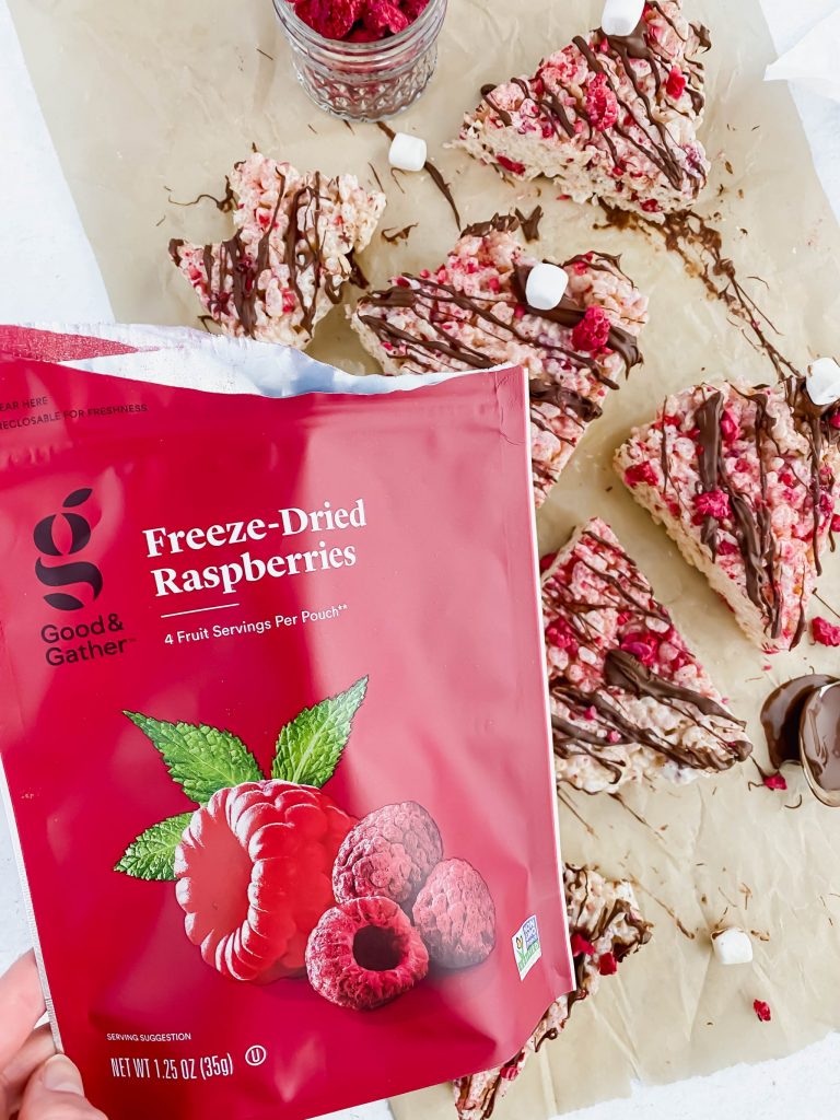 close up image of the freeze dried raspberry bag with rice krispies behind it