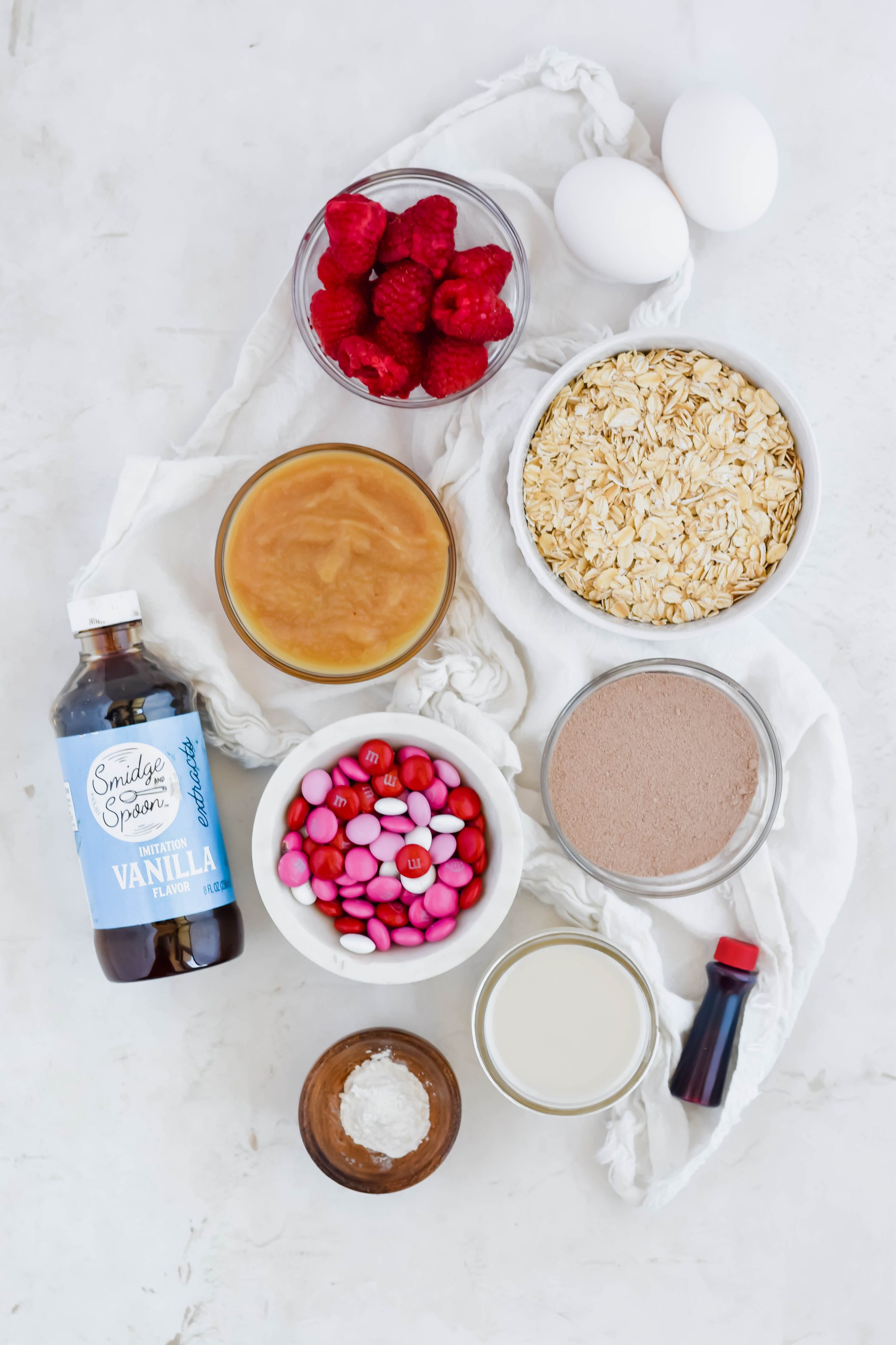 Healthy Red Velvet Protein Pancake ingredients in individual bowls on white background.