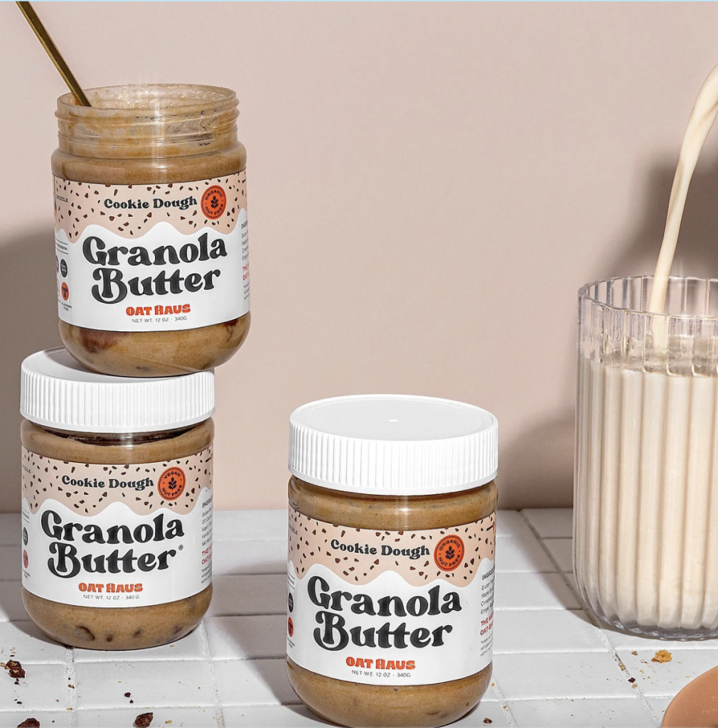 2 stacked oat haus granola butter jars and an addition third jar next to stack