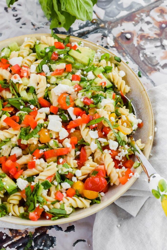 Chickpea Pasta Salad in a big bowl with a salad spoon