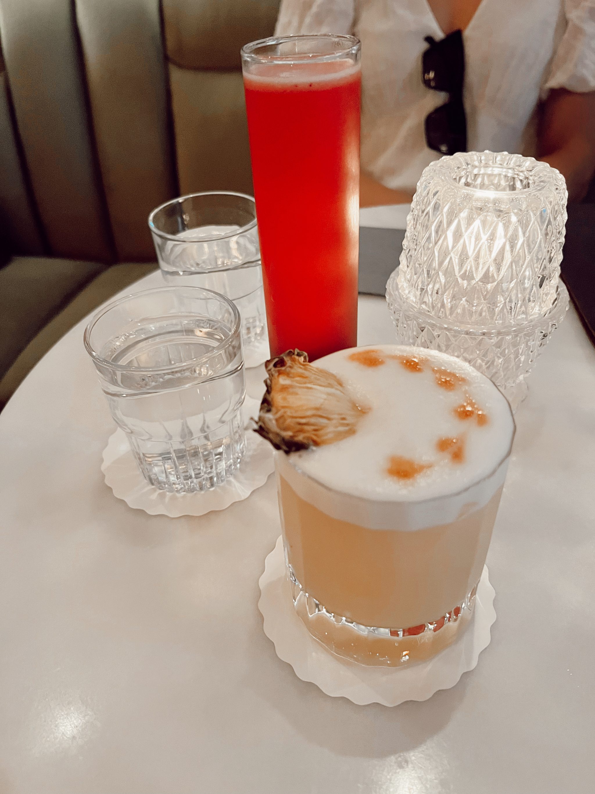 pineapple rum cocktail on a white marble table
