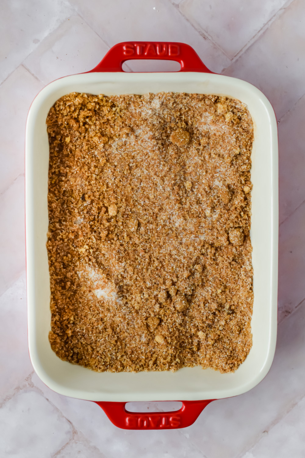cinnamon sugar french toast in white and red baking dish.