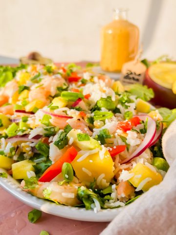 shrimp and mango salad on oval serving plate.