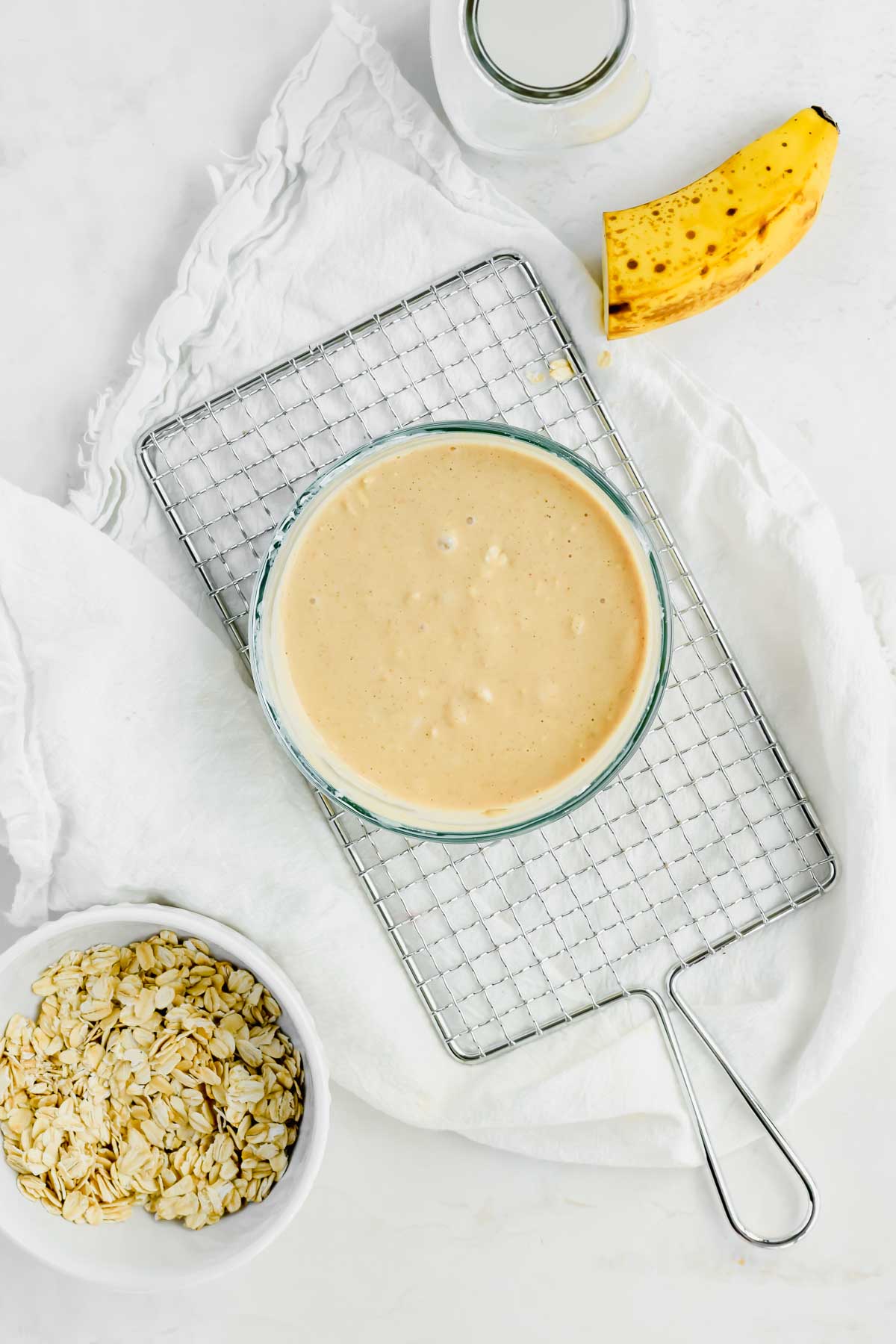 Banana Peanut Butter Overnight Oats batter in a small glass bowl.