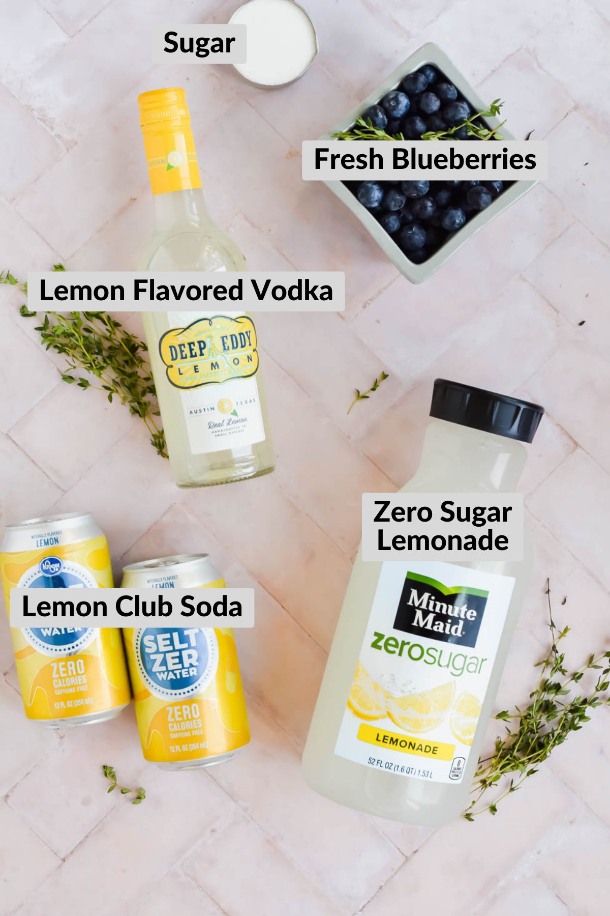 ingredients for blueberry vodka lemonades on stone background.