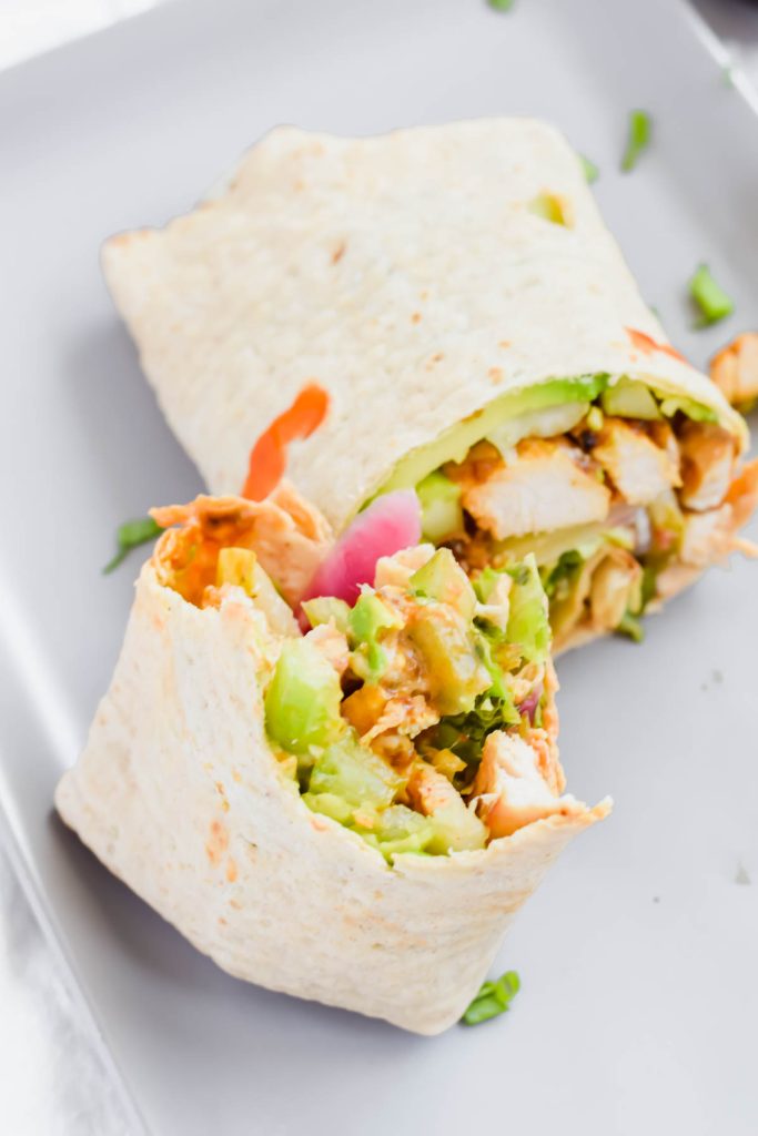 buffalo chicken wrap with a bite taken out of it.