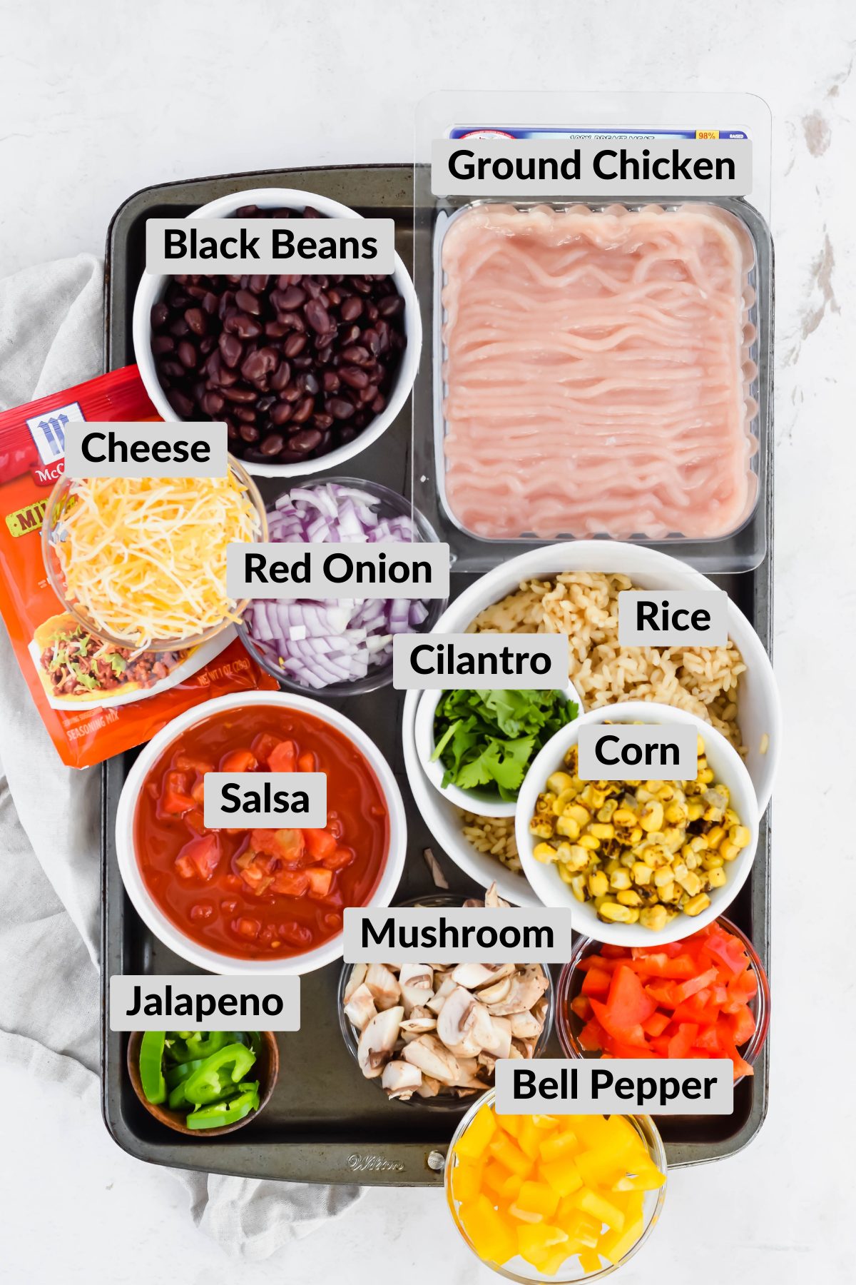 ingredients for cheesy mexican skillet in individual bowls.