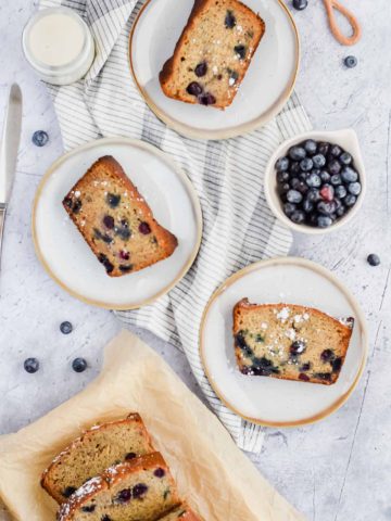 3 slices of Blueberry Banana Bread on plates.
