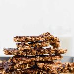 peanut butter chocolate granola clusters stacked on top of each other.