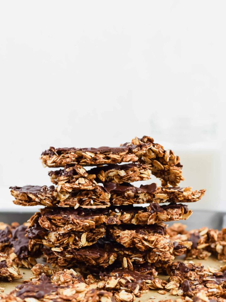 peanut butter chocolate granola clusters stacked on top of each other.