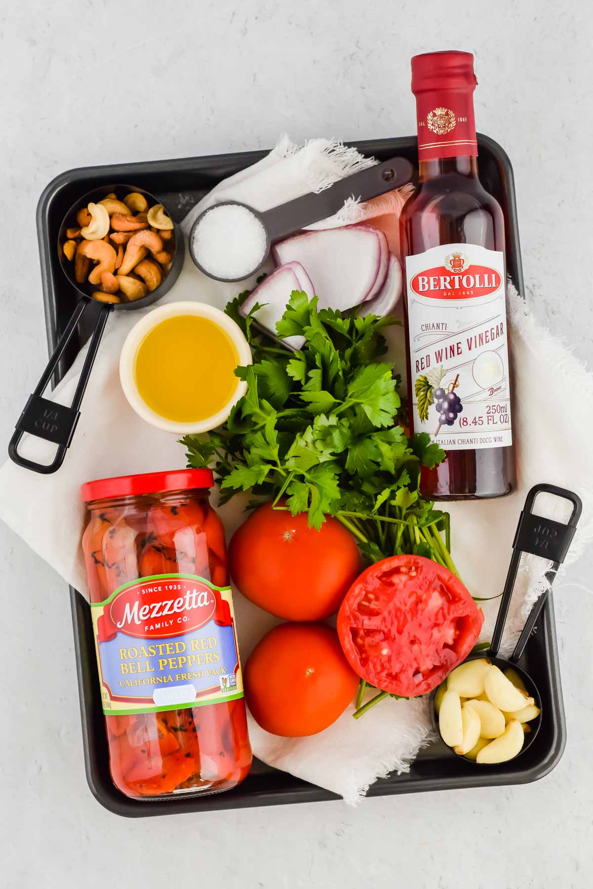 sheet pan tray that has all of the romesco dip ingredients on it.