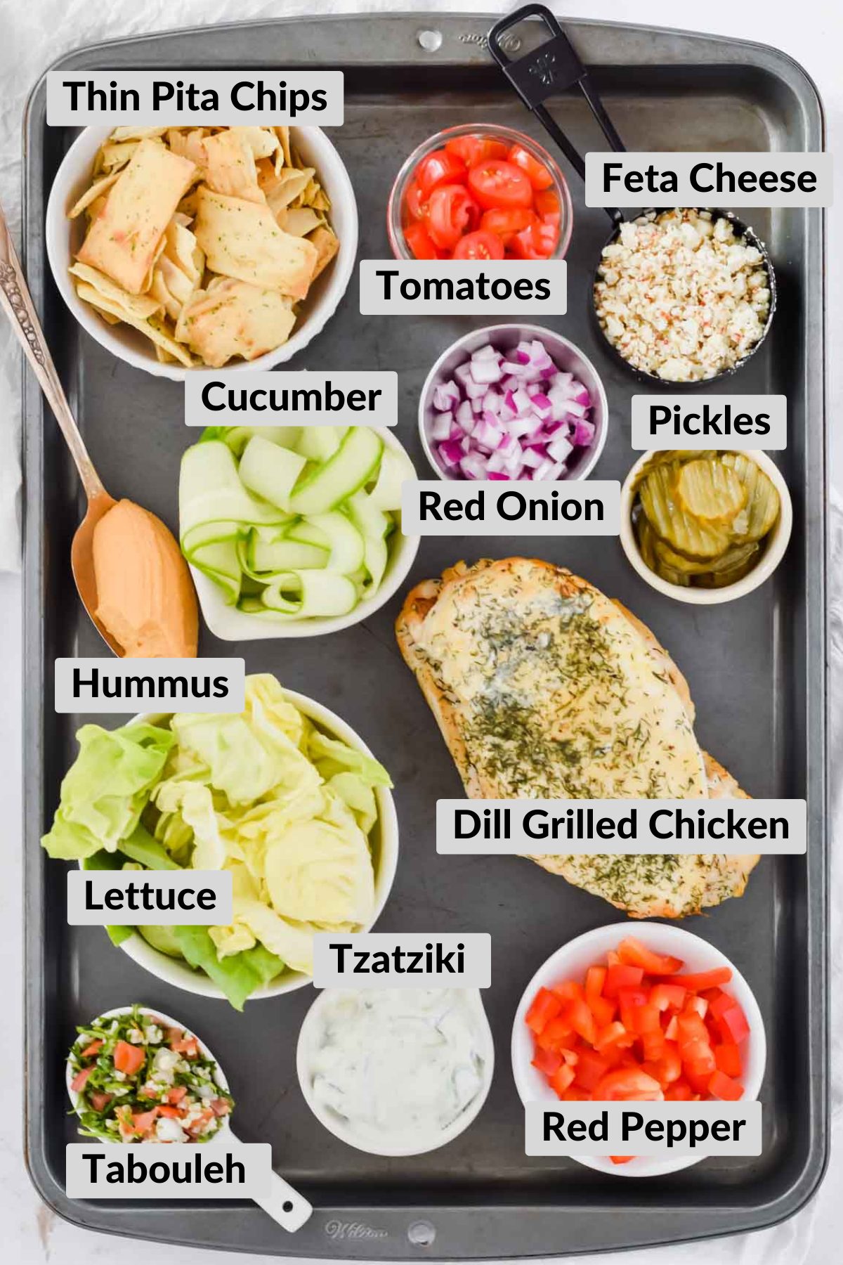 ingredients needed for The Best Mediterranean Salad recipe in individual bowls.