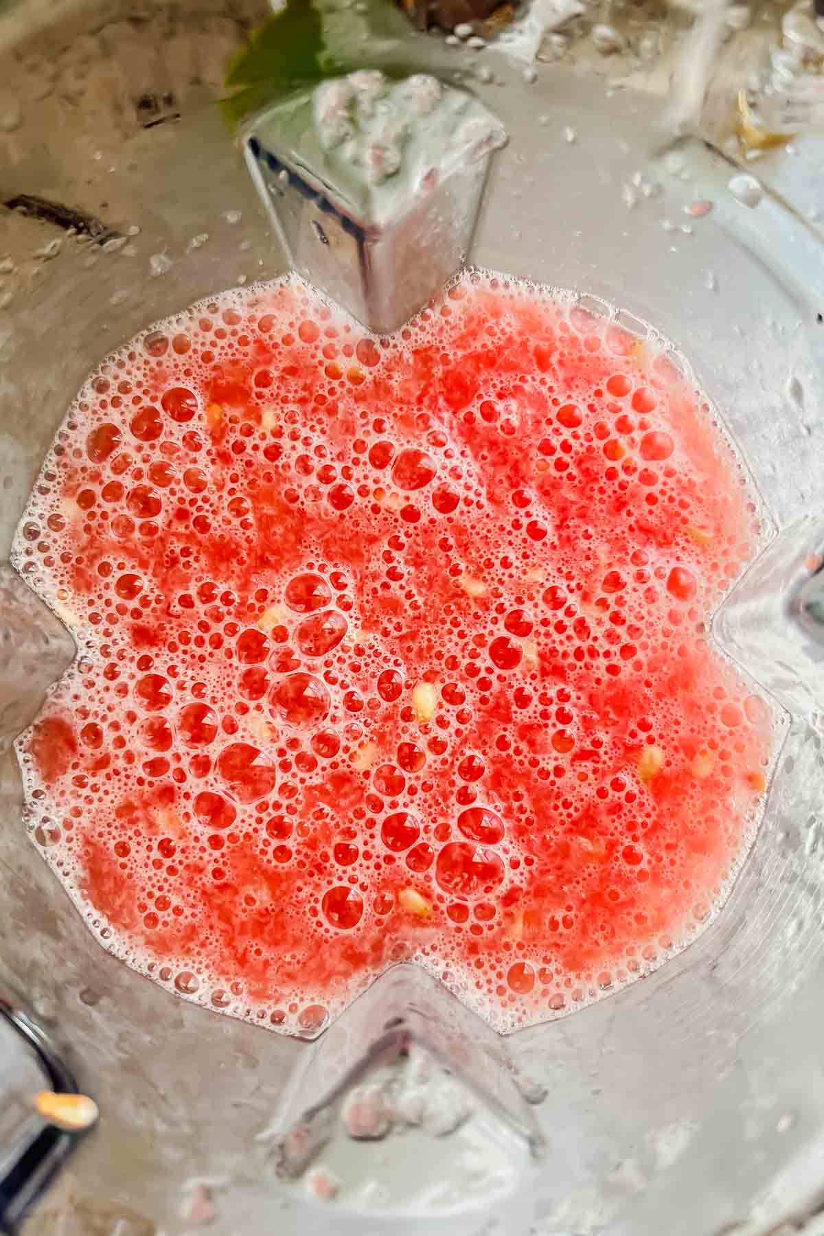 pink watermelon vodka slush mixture in blender.