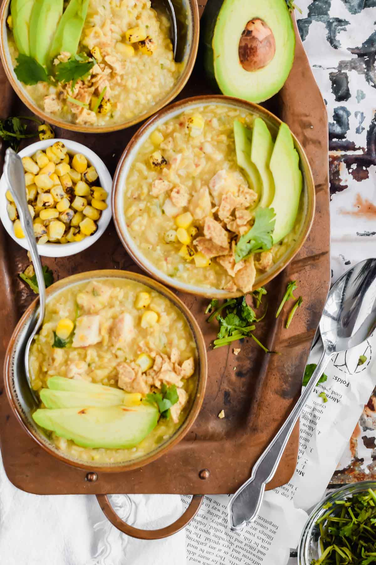 Three bowls of Dairy Free White Chicken Chili recipe on a metal serving tray.