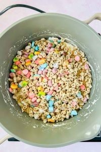 lucky charms in gray sauce pot with melted marshmallows.