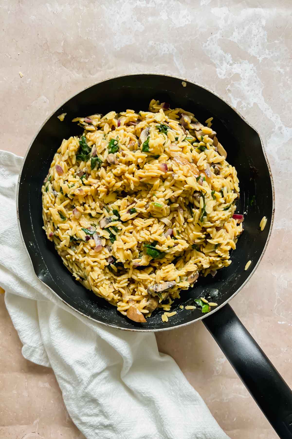 gouda cheese mixed into the cooked mushroom rice pilaf in skillet. 