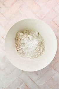 oat flour in white bowl.