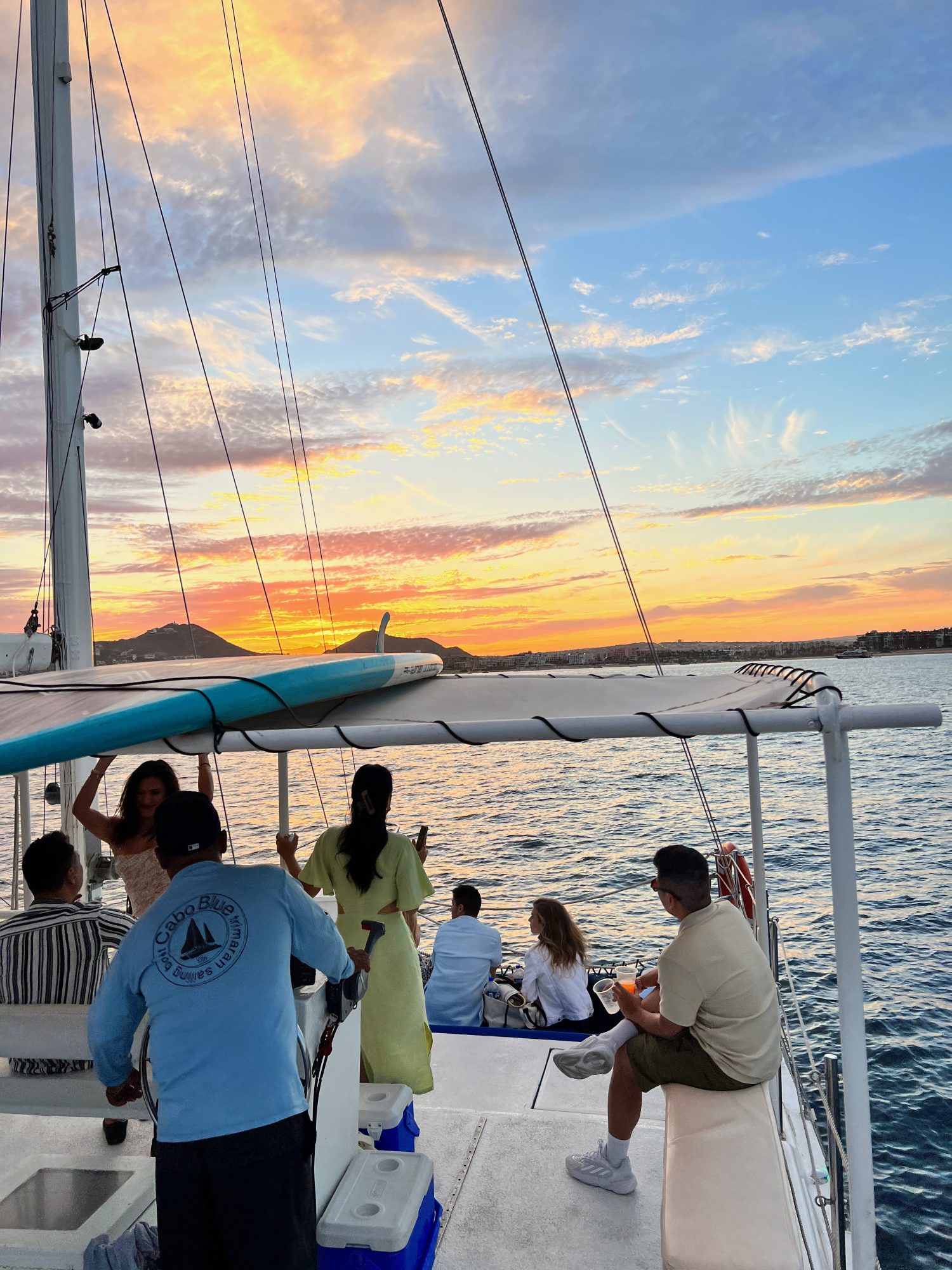 multi-colored sunset over the gulf of Califlornia on a catamaran boat. 
