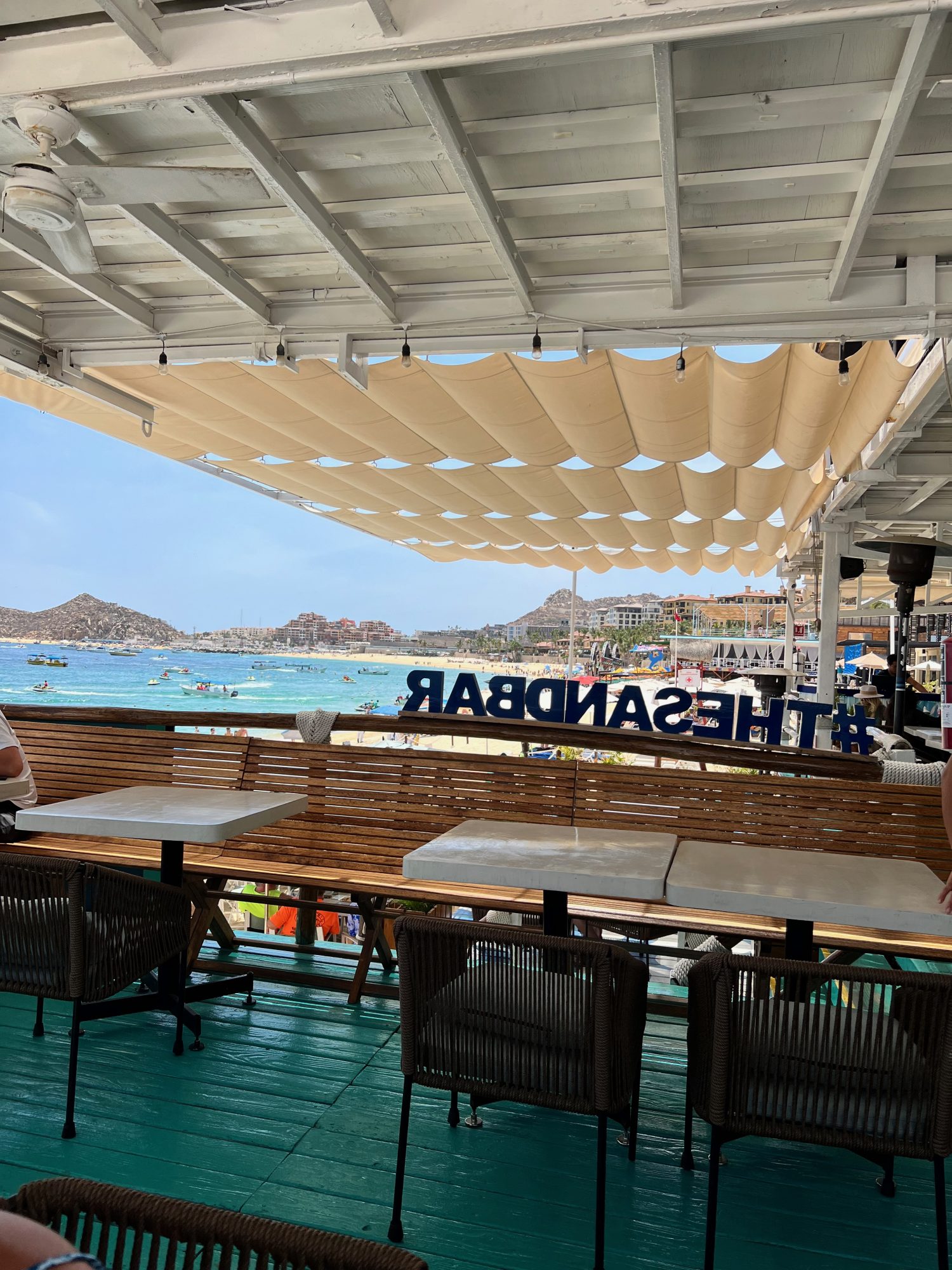 view of Cabo San Lucas beach from the top deck of the Sand Bar restaurant. 