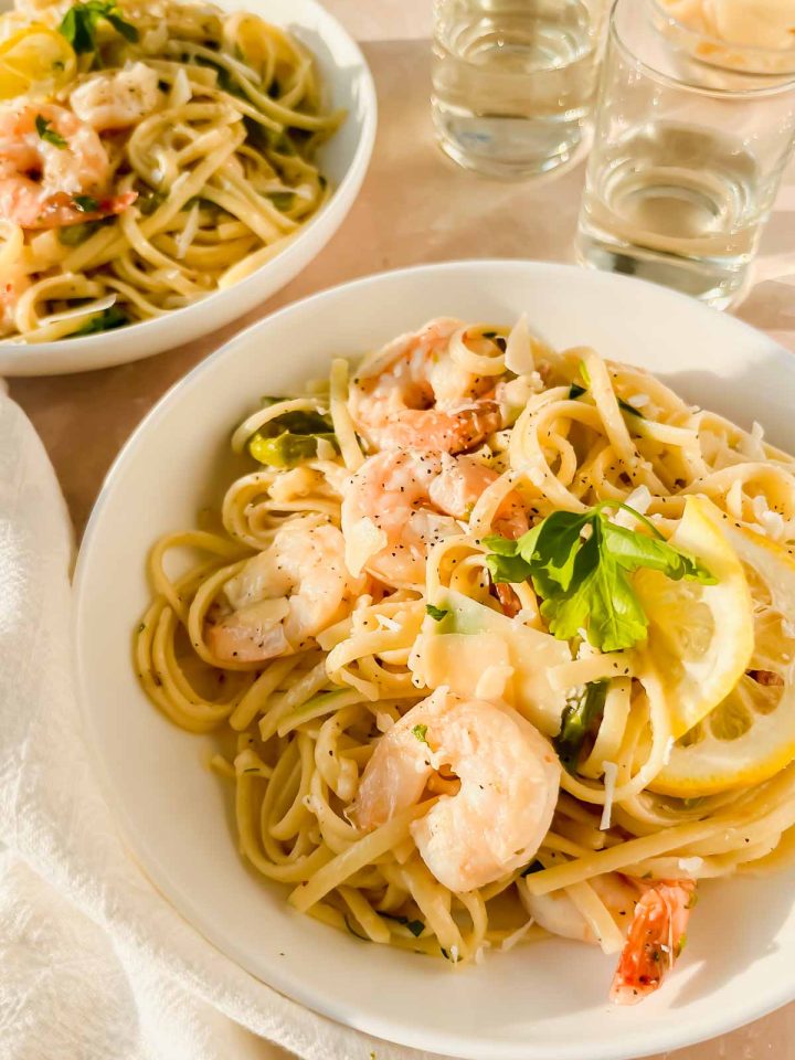 lemon garlic shrimp pasta in white serving bowl.