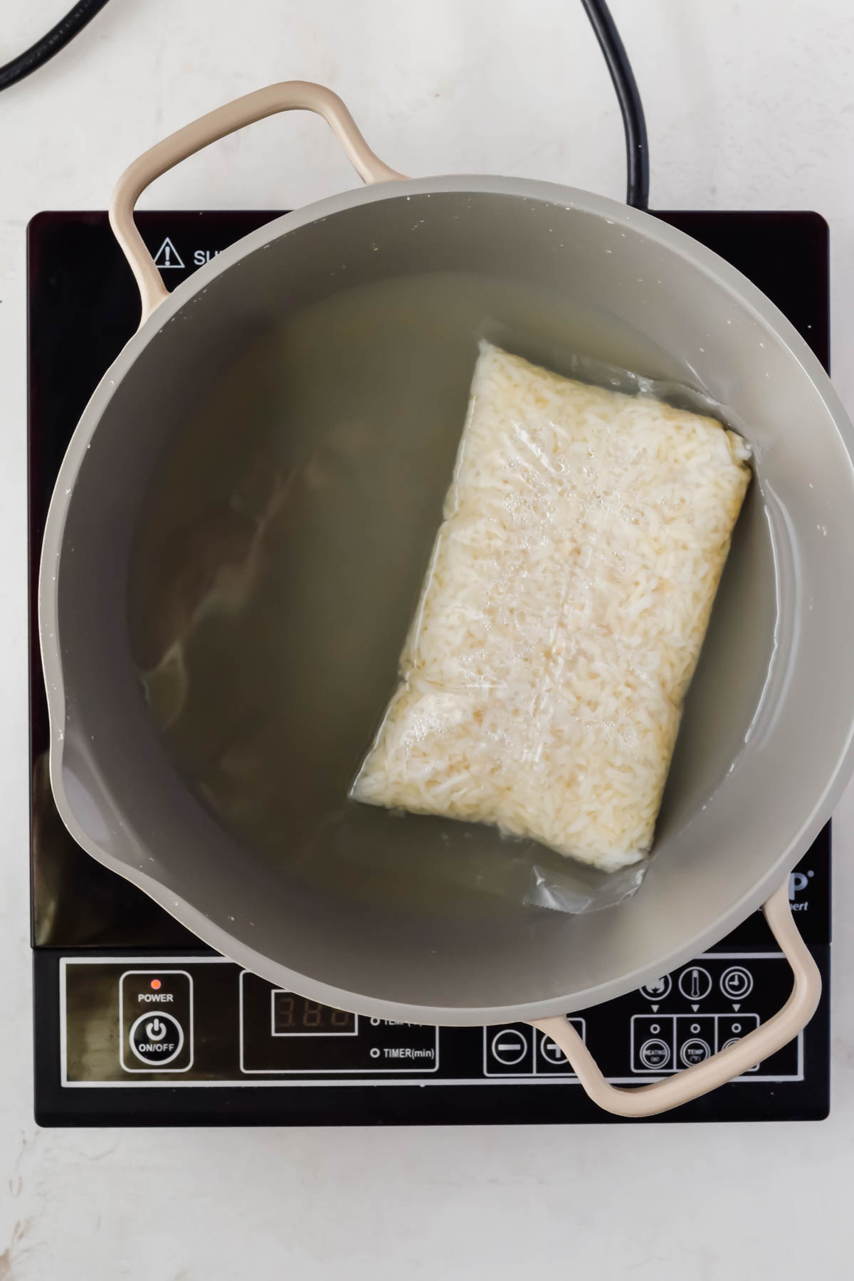 boil in bag rice in gray sauce pot.