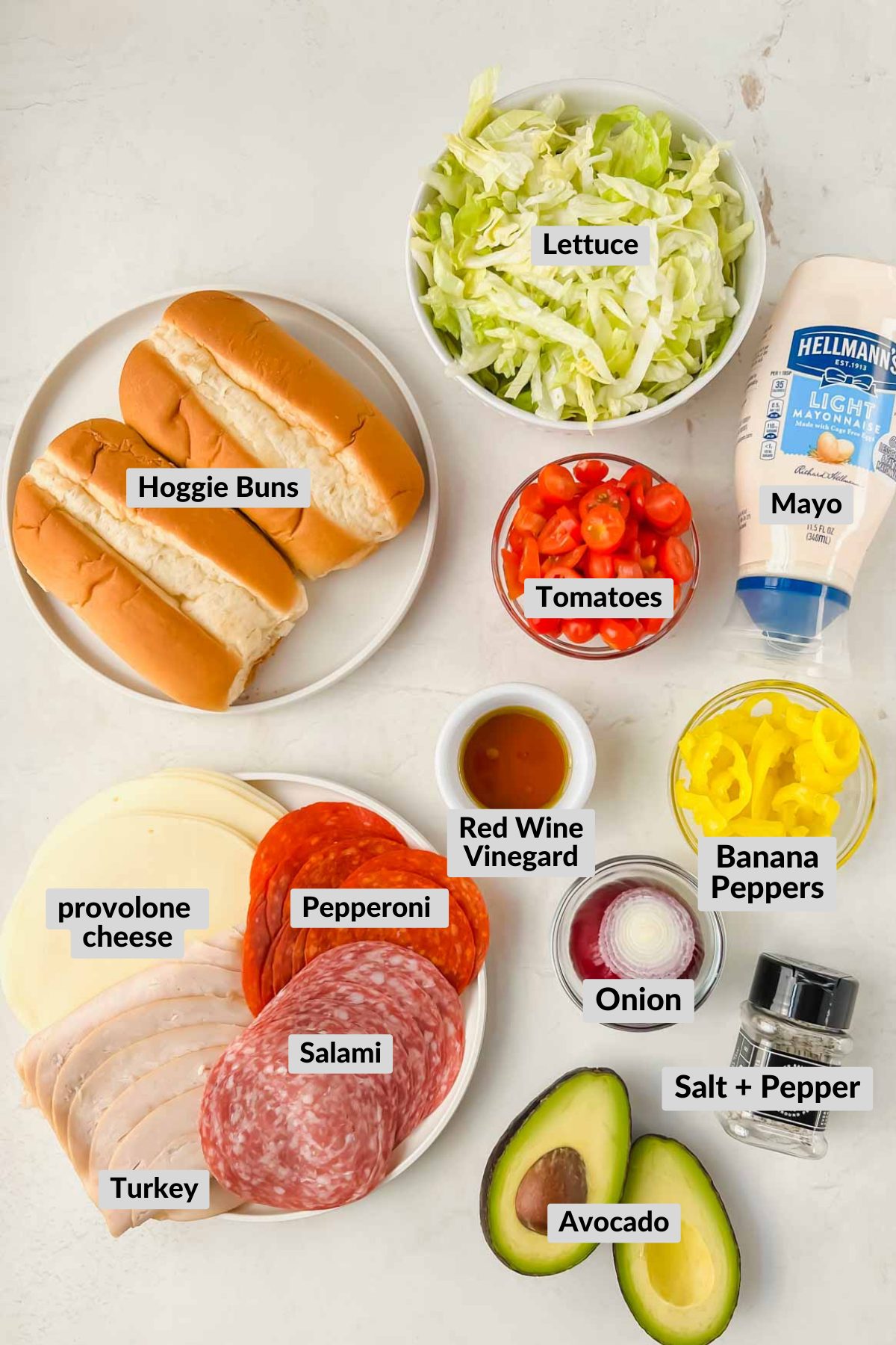 labeled grinder sandwich ingredients in individual bowls.