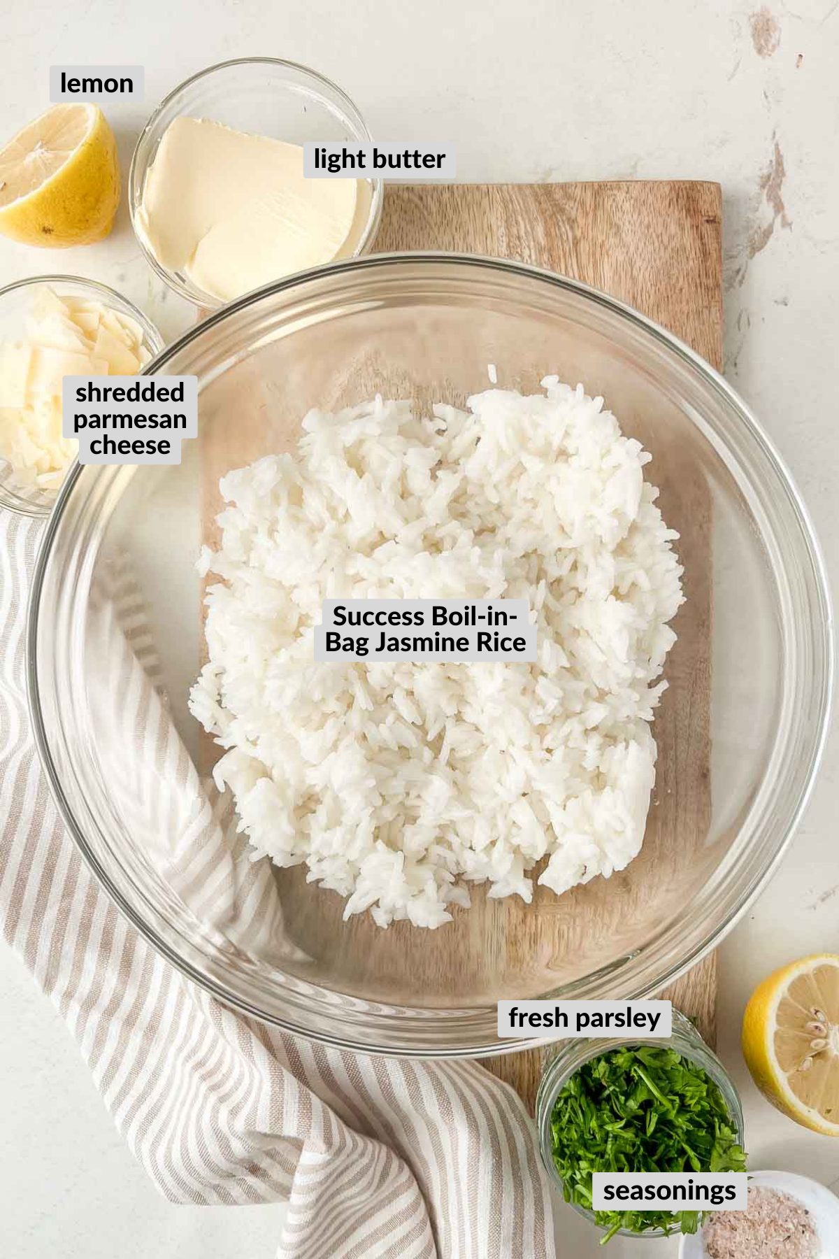 labeled ingredients for parmesan rice recipe in individual bowls.