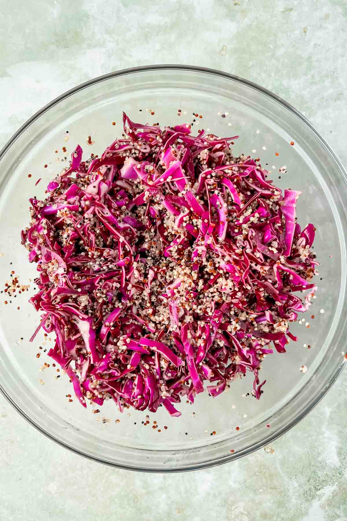 massaged purple cabbage and quinoa in large mixing bowl. 