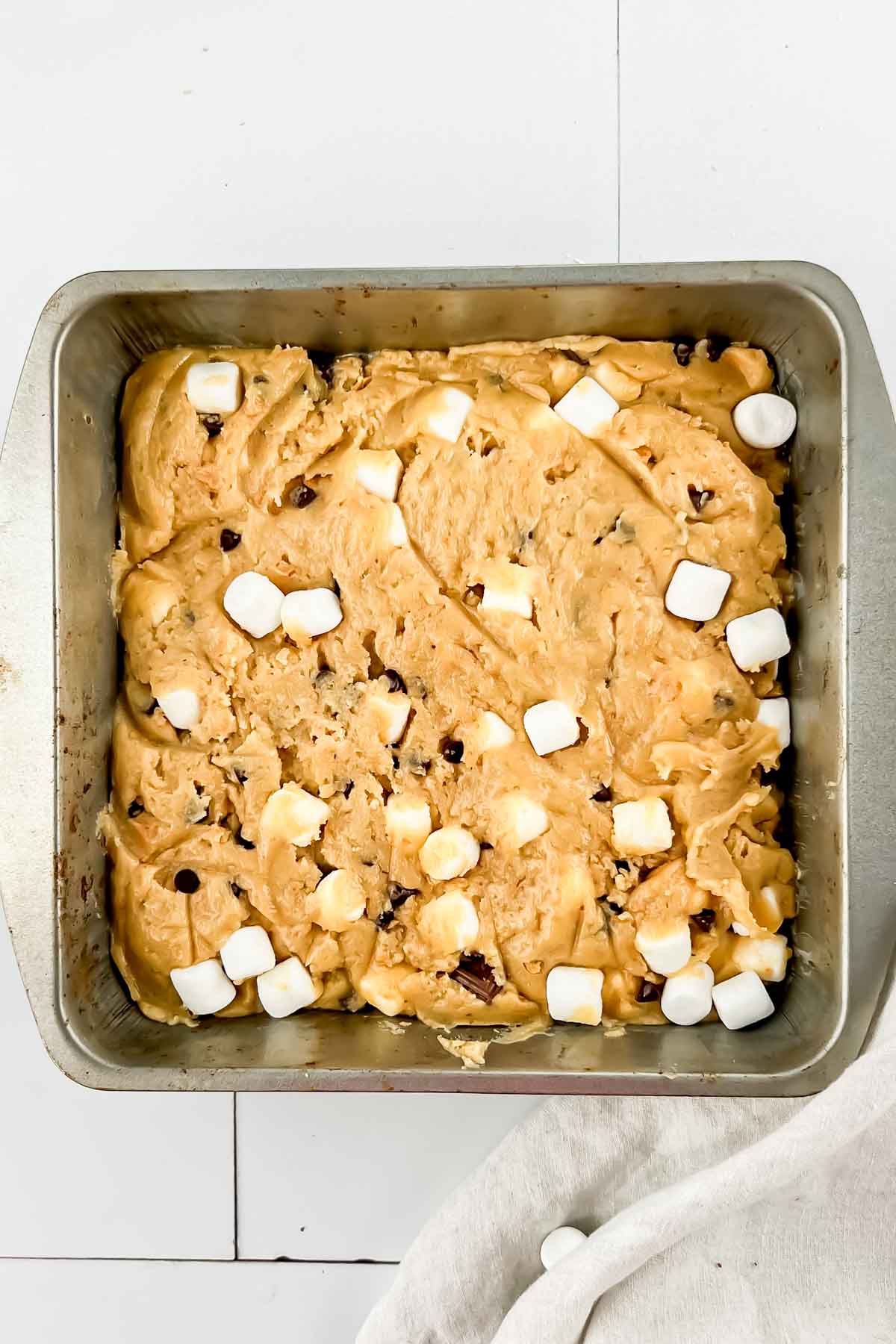 Smores casserole in square pan before baking.