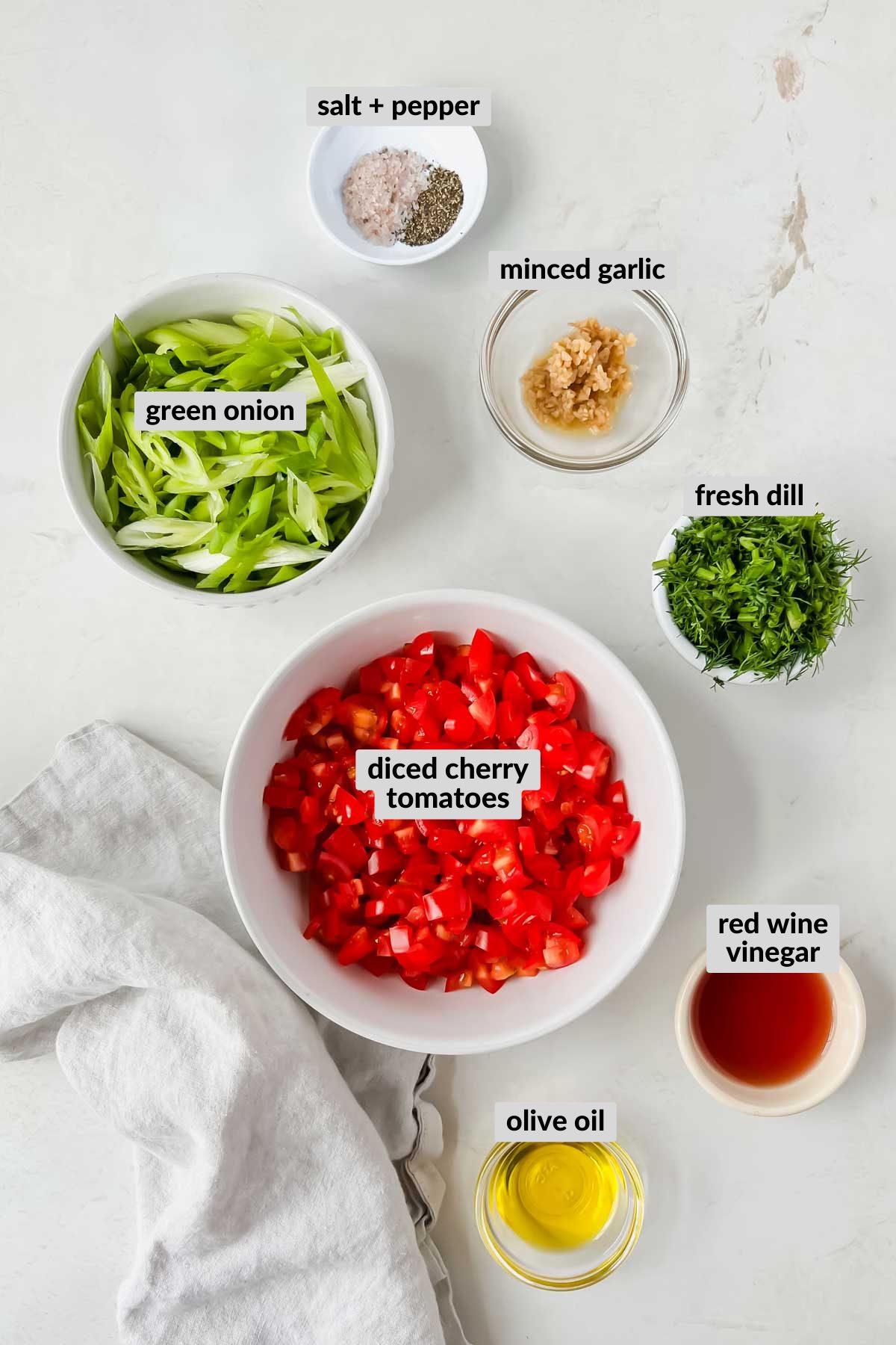 labeled ingredients for tomato relish recipe in individual bowls,
