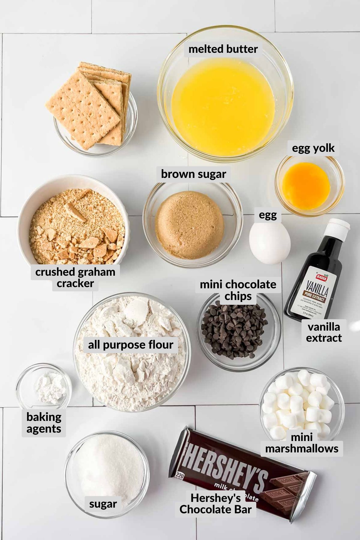 smores casserole ingredients in individual bowls.