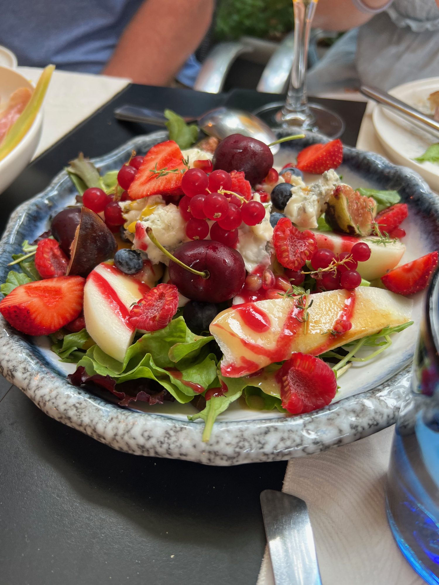 seasonal fresh fruit salad served over a bed of greens. 