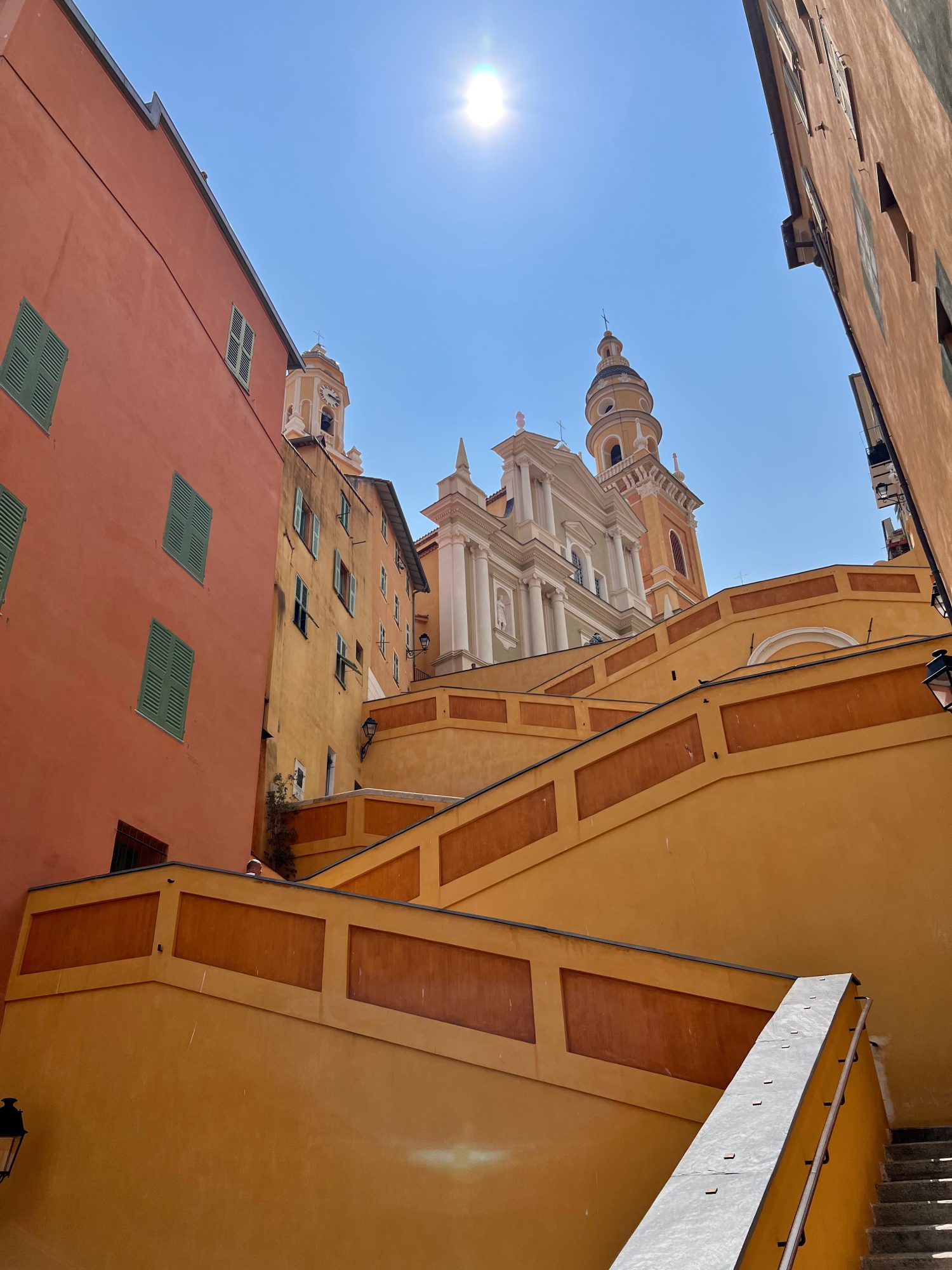 steps and architecture leading up to the top of Menton, France.