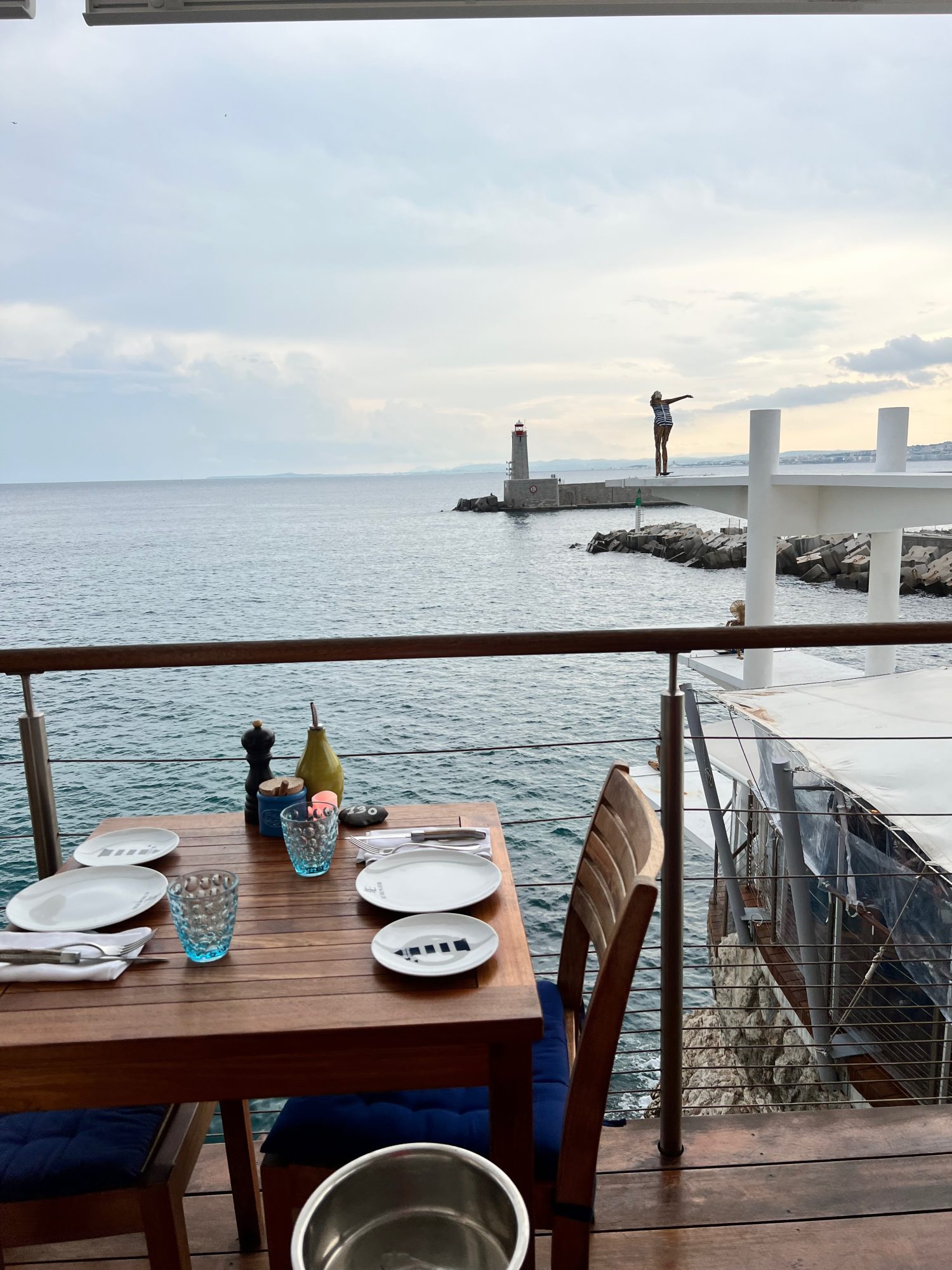 tabletop view of Le Plongeoir overlooking the marina and ocean. 